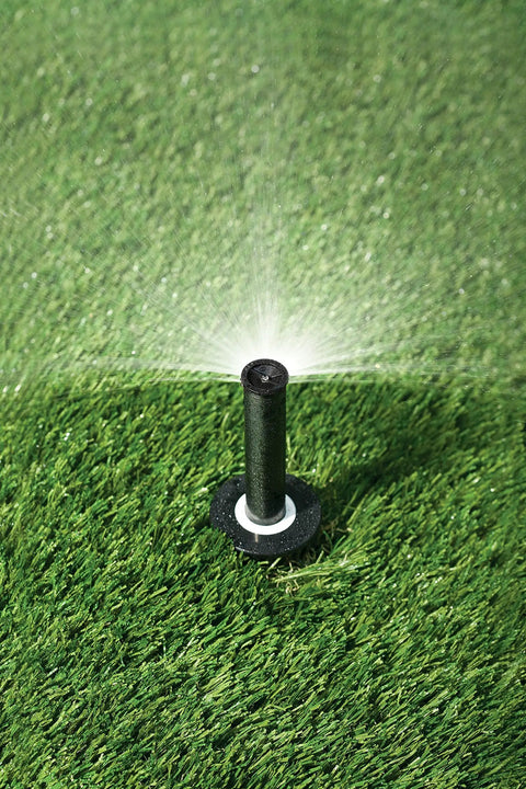 Reliable Half Circle Lawn Spray Nozzle With Adjustable 8 To 15 Feet Reach spraying water on green grass surface