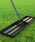 Heavy Duty Lawn Leveling Rake With 36 Inch Head And 7.2 Ft Handle Ground Plate Leveler shown on grass