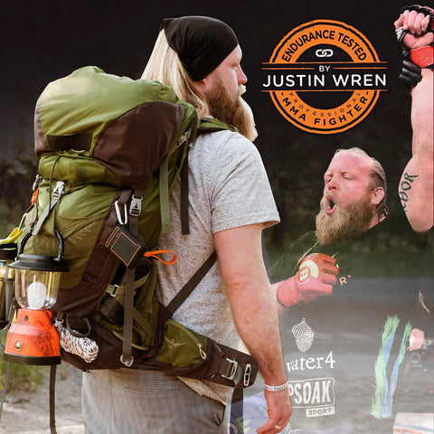 Man hiking with backpack and Ultra Bright LED Camping Lantern With 800 Lumens, Battery Powered Emergency Light attached to side.