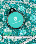 ProSeries 98 Inch Retractable Tape Measure With Leatherette Case Teal Color Pocket Friendly on floral fabric