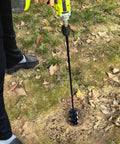 Person using 32 Inch Long Garden Auger Drill Bit For Planting Bulbs And Post Holes, Heavy Duty Three Eighths Inch Hex Drive