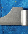 Metal paddle from 8-BBP-P070 Paddle Blade Replacement Pack Of 2 For BB-PAC20 Bread Machine on blue background.