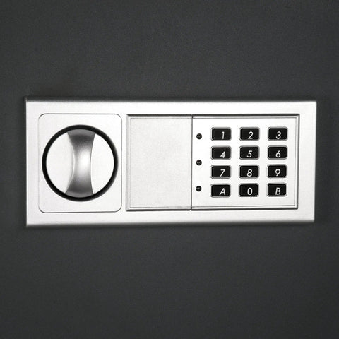 Hidden In Wall Safe With Electronic Keypad And Two Manual Override Keys For Home Or Office, close-up of keypad and lock dial