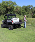 60 Gallon Prime Spot Sprayer With 2.2 GPM On Demand Diaphragm Pump mounted on UTV, spraying isolated areas, white finish