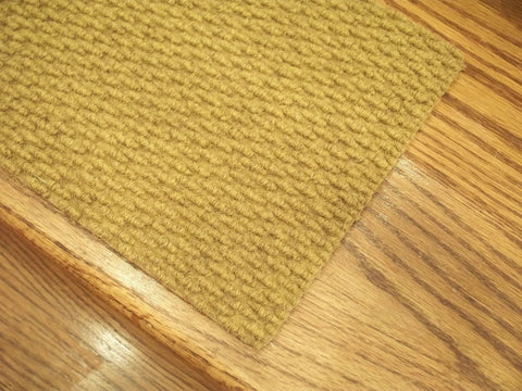 Close-up of Berber Style Natural Carpet Stair Tread with 24 by 8 inch size and non-slip backing on wooden stairs.