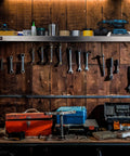 Stainless Steel Wall Shelf 24 Inch Wide by 12 Inch Deep, heavy duty storage in garage with tools and toolboxes below.