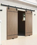Heavy Duty Outdoor Sliding Barn Door Hardware Kit, 16 Ft Rail System, 450 Lb Capacity installed on exterior wooden doors