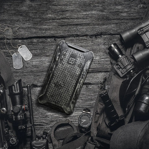 Dark Energy Poseidon Pro Indestructible Portable Charger 10,000 mAh Black With USB A And USB C Connectors on wooden surface