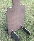Portable 3/8 Inch AR500 Steel Shooting Ground Target 12x20 on grass with stand and legs visible, showing side profile.