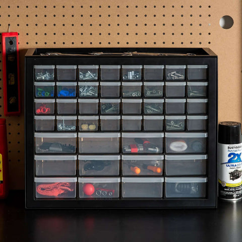Small Parts Storage Cabinet With 44 Drawer Organizer For Screws Nuts Bolts Electronics Hardware Beads Crafts And More, Built Tough Made In USA Stackable Black Boss Grade on a workbench.