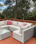Outdoor deck with wicker sofa set, glass-top table, and Deck Or Fence Mount For Tiki Torches And 1-1/4-Inch Poles Fits Solar Lights Black Outdoor Torch Bracket visible.