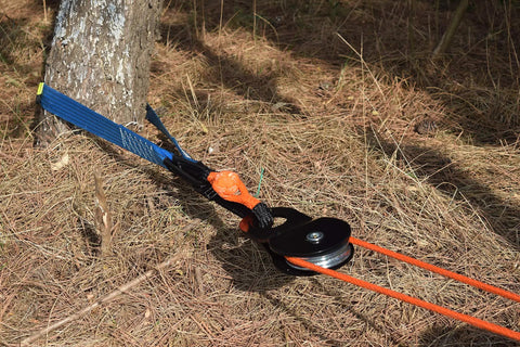 Off Road Winch Rope Extension For ATV UTV Three Eighth Inch Synthetic Cable Eighty Four Feet Orange Abrasion Resistant With Protective Sleeve and PVC Sheath Easy To Use Recovery Line For Tough Trails attached to tree with pulley system