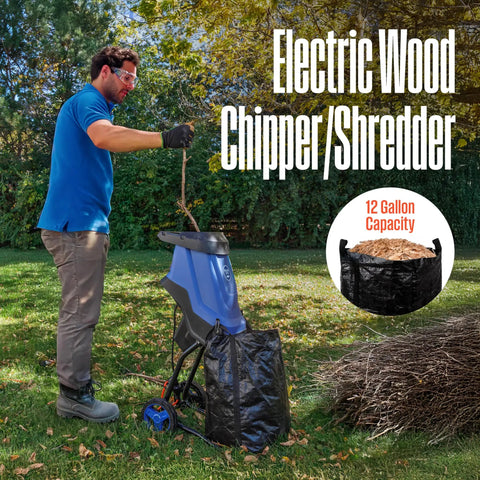 Man using Corded Electric Wood Chipper Shredder Be The Yard Boss With 1.7 Inch Capacity And 15 Amp Motor in garden