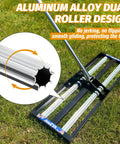 Pro Grade Heavy Duty Lawn Leveling Rake With Aluminum Rollers And Stainless Steel Build, shown on grass.