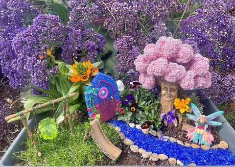Ethan's Magical Tree With Matching Fairy Bench, 9 inch tall resin tree and 2.75 inch bench in miniature fairy garden display outdoors.