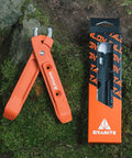 Bike Tire Levers With Chain Master Link Pliers Kit for Mountain Road BMX Bikes, orange tool on mossy rock surface