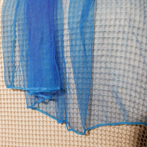 Close-up of blue net fabric from Glow In The Dark Stars Canopy Bed For Girls With Galaxy Lights And Princess Net Tent
