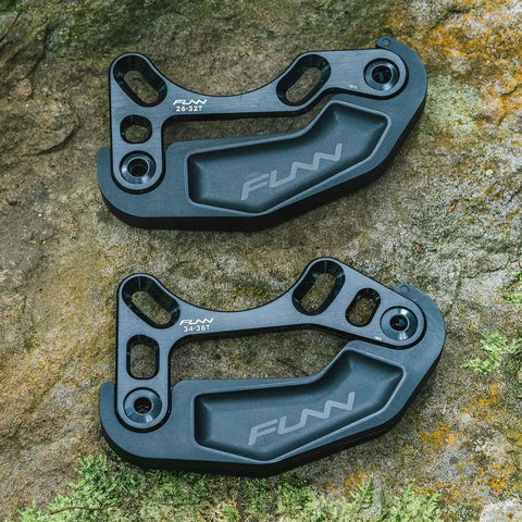 Zippa Lite MTB Bash Guard for ISCG05 Mount Fits 26T To 32T Chainrings Bicycle Chain Guard And Protector For Mountain Bikes And BMX Easy Install Keeps Your Chainring Safe On Tough Trails in black, showing top and bottom view.