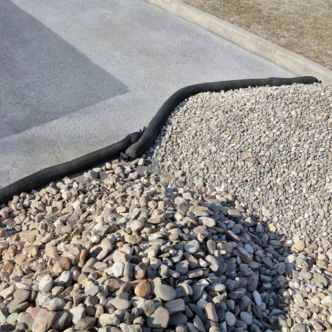 Sediment Filter Sock For Erosion Control And Storm Drain Protection, Highly Efficient Debris Barrier placed on gravel slope