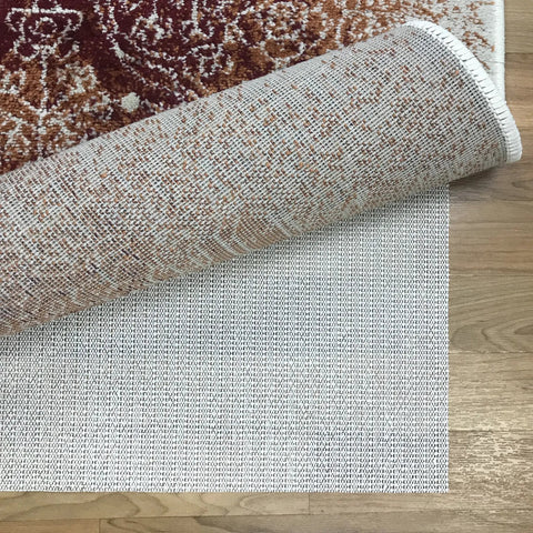 Cream open weave rug pad keeping rugs anchored solid on hardwood or tile floors, showing detail and texture.
