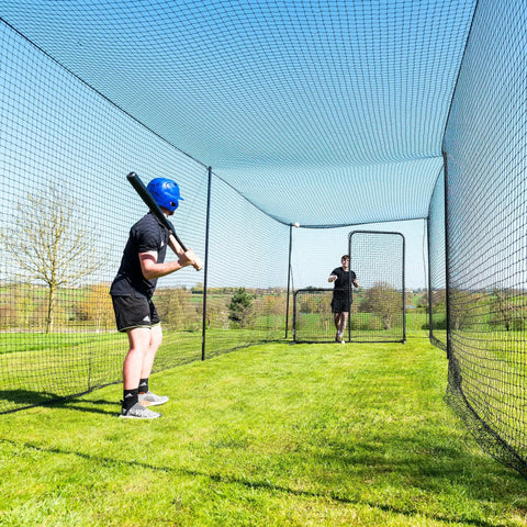 Baseball player in Ultimate Baseball Batting Cage System With Durable Frame And Flexible Lengths From 20 Ft To 70 Ft, outdoor setup