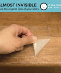 Applying Clear Non Slip Tape 2 Inch By 30 Feet Traction Grip Tape For Tubs Boats And Stairs on wooden surface