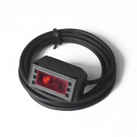 BG 1000N Photoelectric Sensor Switch With Background Suppression Diffuse Sensor, LED display, 2M cable coiled around sensor, close-up view.