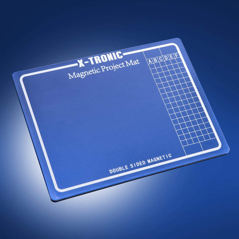 Magnetic work mat included in the 30V 5A Bench DC Power Supply Kit With USB Output, featuring a grid pattern for organization.