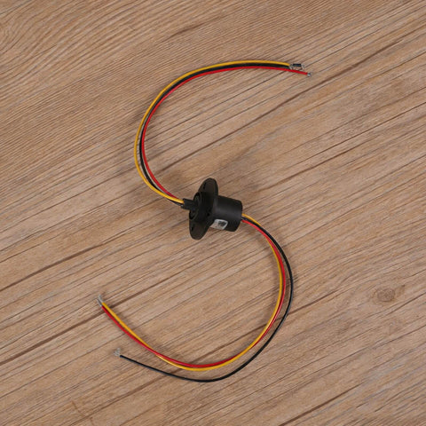 High Current Slip Ring Rotating Connector With 3 Wires 10A 22Mm Diameter, shown with colored wires on a wooden surface