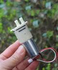 Hand holding Ultra Compact Self Priming Diaphragm Water Pump, DC 6V to 12V, 370 Micro Motor, Mini Suction Pump for DIY projects