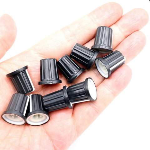 Set Of 10 D Type Potentiometer Knobs For 6mm Shafts in hand, black plastic knobs for audio mixers and electric guitars, 16 x 18mm