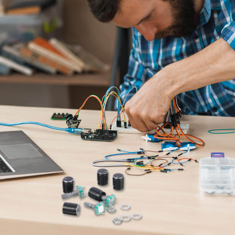 Person assembling electronics with 360 Degree Rotary Encoder Code Switch With Push Button, Five Pin Digital Potentiometer