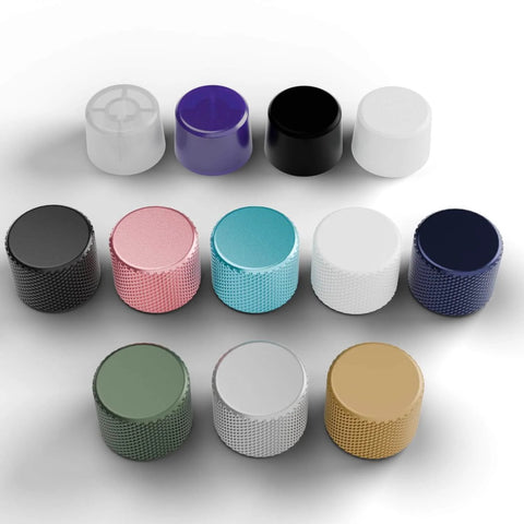 Assorted metal and plastic rotary knobs for GMMK keyboards, including Rotary Knob Upgrade For GMMK Keyboards In Liquid Gold Metal Finish With Tool Free Installation Easy Snap On Replacement Premium Aluminum Dial Knob Delivers Smooth Grip And Sleek Look To Level Up Your Keyboard Aesthetic And Feel, shown in various colors and textures.