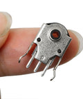 Close-up of 5 Pack Mouse Encoder Switch Kit For 9mm Wheel Encoders, black silver, durable plastic metal build, held between fingers.