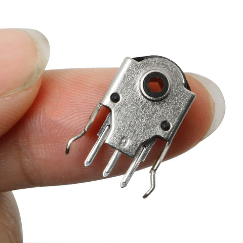 Close-up of 5 Pack Mouse Encoder Switch Kit For 9mm Wheel Encoders, black silver, durable plastic metal build, held between fingers.