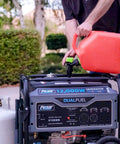 Man fueling Heavy Duty Portable Dual Fuel Generator With Electric Start Delivers 12,000 Peak Watts And 9,500 Rated Watts On Gas