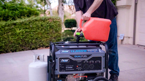 Man fueling Heavy Duty Portable Dual Fuel Generator With Electric Start Delivers 12,000 Peak Watts And 9,500 Rated Watts On Gas