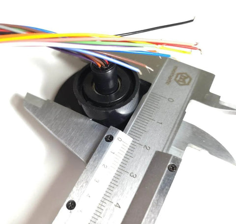 Close-up of High Speed Ball Conductive Slip Ring 12 Wire 2A Collector Ring measured with caliper, showing wire detail.