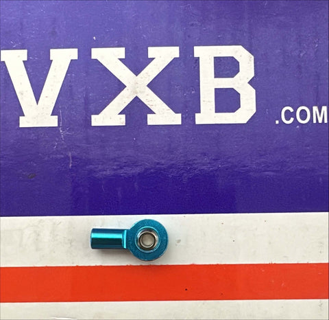 Female Rod End 3mm Blue PHS3 Right Hand Mini Heim Joint on a colorful background.