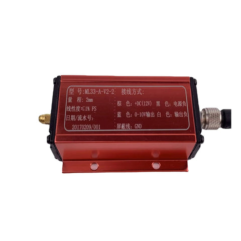 Front view of industrial displacement sensor with eddy current tech, red metal casing, RS485 output, showing connectors and labels