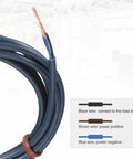 Coiled electrical cable with wiring guide showing black, brown, and blue wires for power connection.