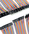 Multicolor ribbon cables from 5 Pack KY-040 Rotary Encoder Module Kit With 120 Multicolor Breadboard Jumpers And Ribbon Cables for DIY projects.