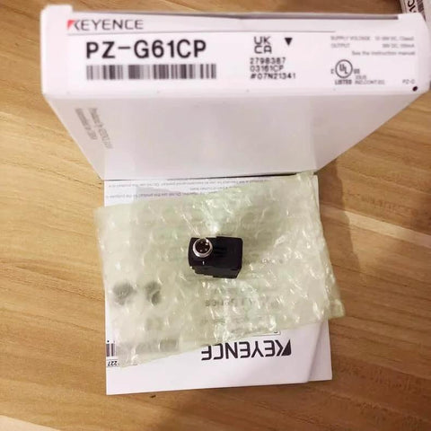 Keyence Photoelectric Sensor PZG61CP in packaging with product box on wooden surface