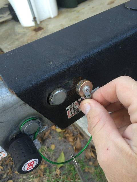 Hand inserting magnetic trailer brake release key for easy backups no vehicle needed stops trailers brakes from locking in reverse fits UC receiver slot