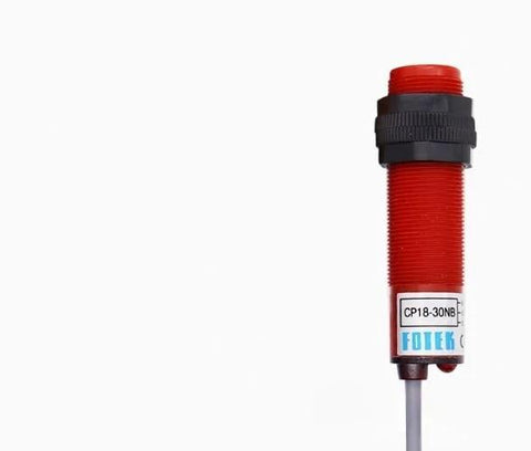 Close-up of CP18-30NB NPN NC proximity sensor, industrial use, easy mount, for conveyor and machine control automation.
