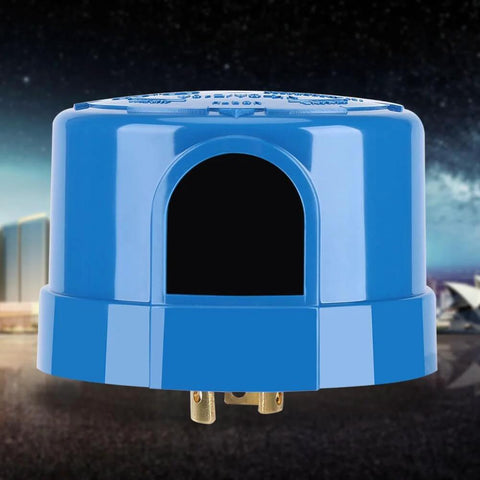 Outdoor Photoelectric Sensor Switch With Automatic Day Night Lighting Control in blue casing against a night sky background