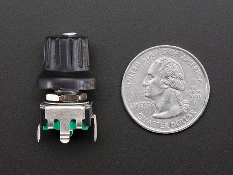 Rotary Encoder With Extras ADA377 24 Pulse Detents Panel Mountable next to US Quarter for size comparison