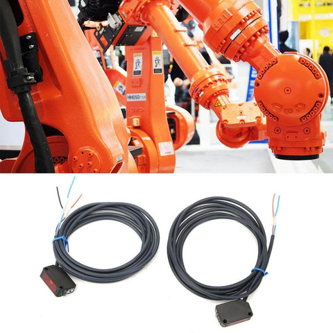 Robotic arm next to photoelectric switch sensor for automatic equipment with infrared IR beam 12 to 24V DC NPN output, plug and play install.