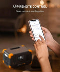 Person using smartphone to control Go To Portable Power Station 288Wh LiFePO4 Battery with 600W Inverter, shown blurred in foreground.