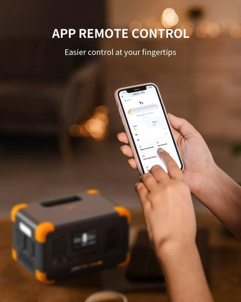 Person using smartphone to control Go To Portable Power Station 288Wh LiFePO4 Battery with 600W Inverter, shown blurred in foreground.